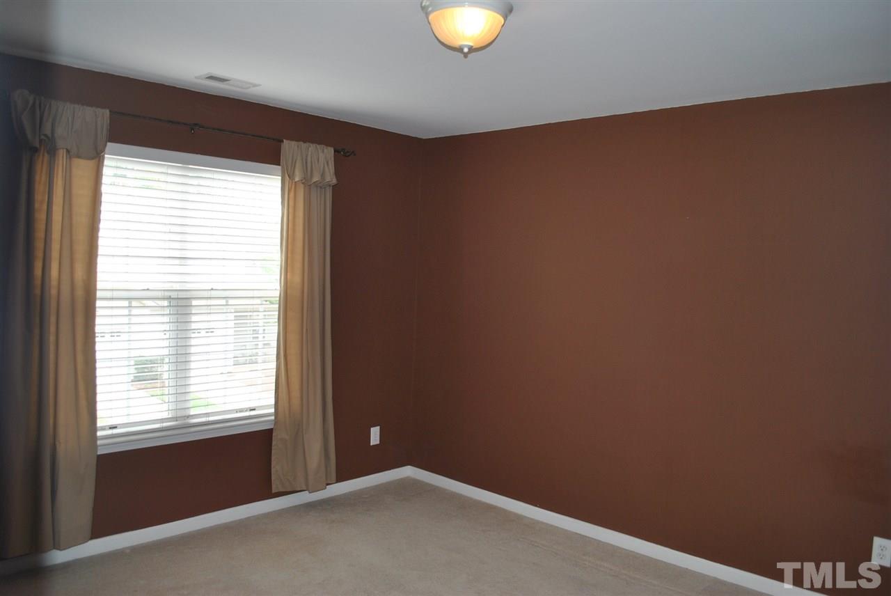 8234 Belneath Court Raleigh, NC 27613 - Photo 17 of 20 a view of an empty room with a window