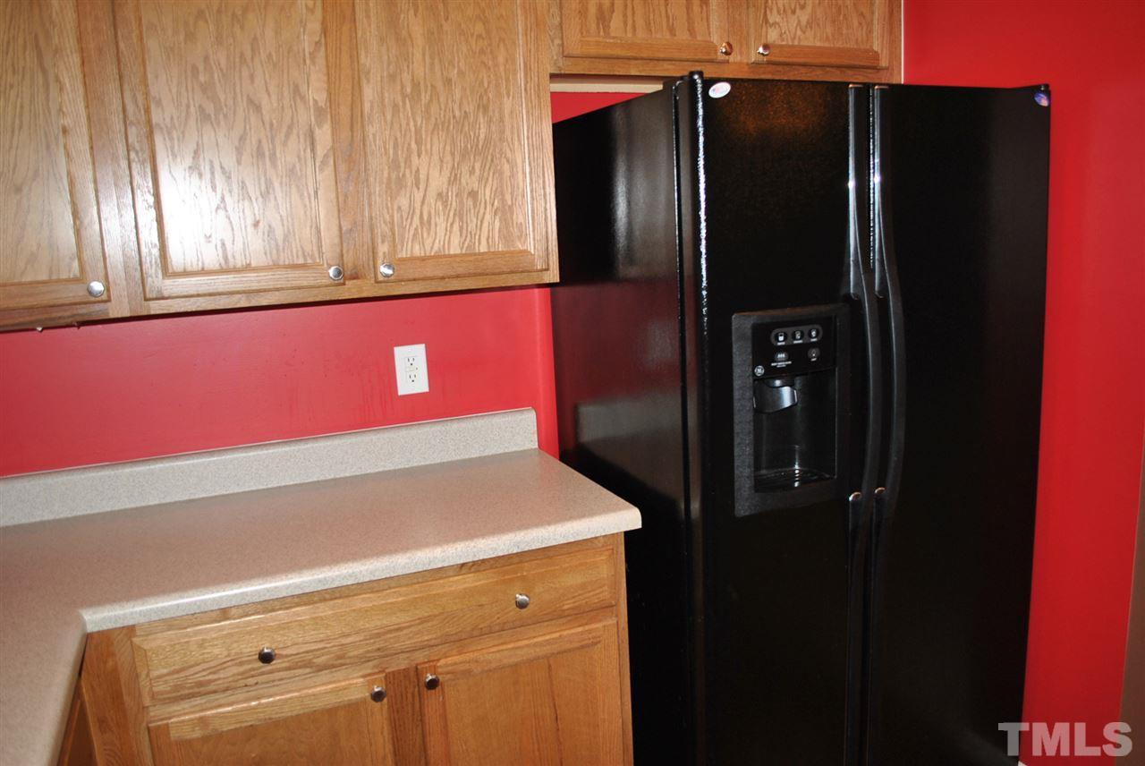 8234 Belneath Court Raleigh, NC 27613 - Photo 4 of 20 a close view of refrigerator and window