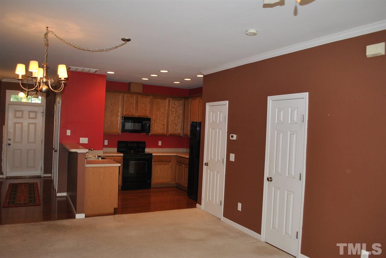 8234 Belneath Court Raleigh, NC 27613 - Photo 5 of 20 a kitchen with stainless steel appliances granite countertop a refrigerator and a stove