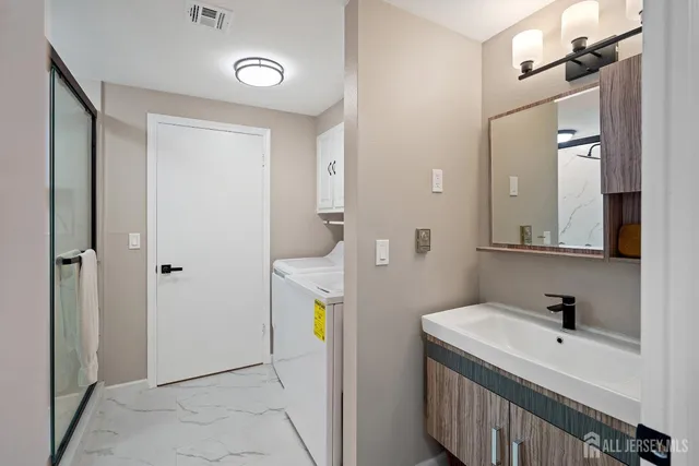 a bathroom with a sink and a mirror