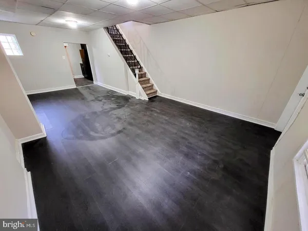 an empty room with wooden floor