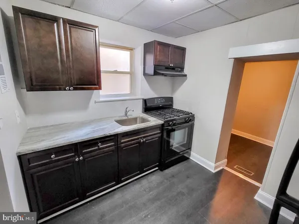 a kitchen with sink cabinets and window