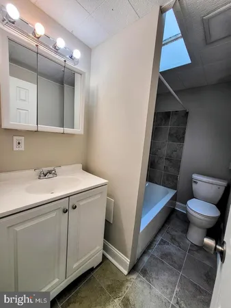 a bathroom with a sink and mirror