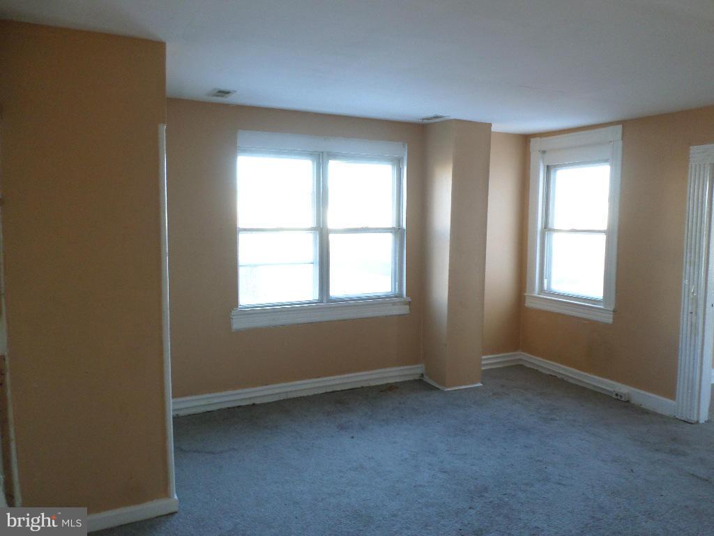 4534 Harford Road Baltimore, MD 21214 - Photo 12 of 18 a view of an empty room with a window