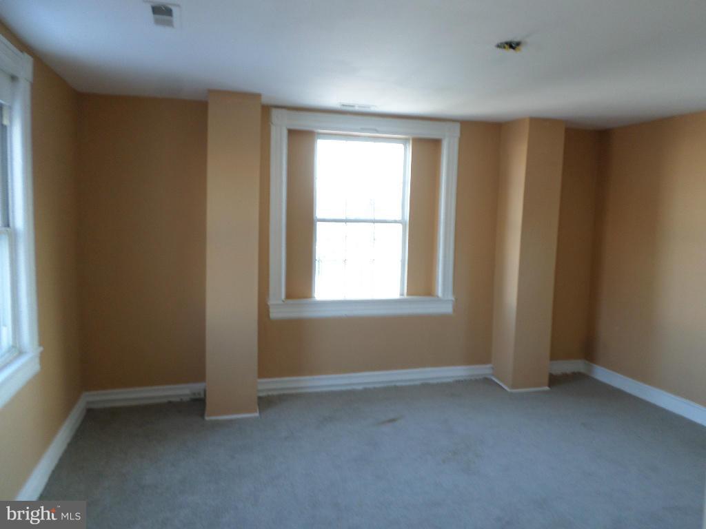 4534 Harford Road Baltimore, MD 21214 - Photo 14 of 18 an empty room with windows