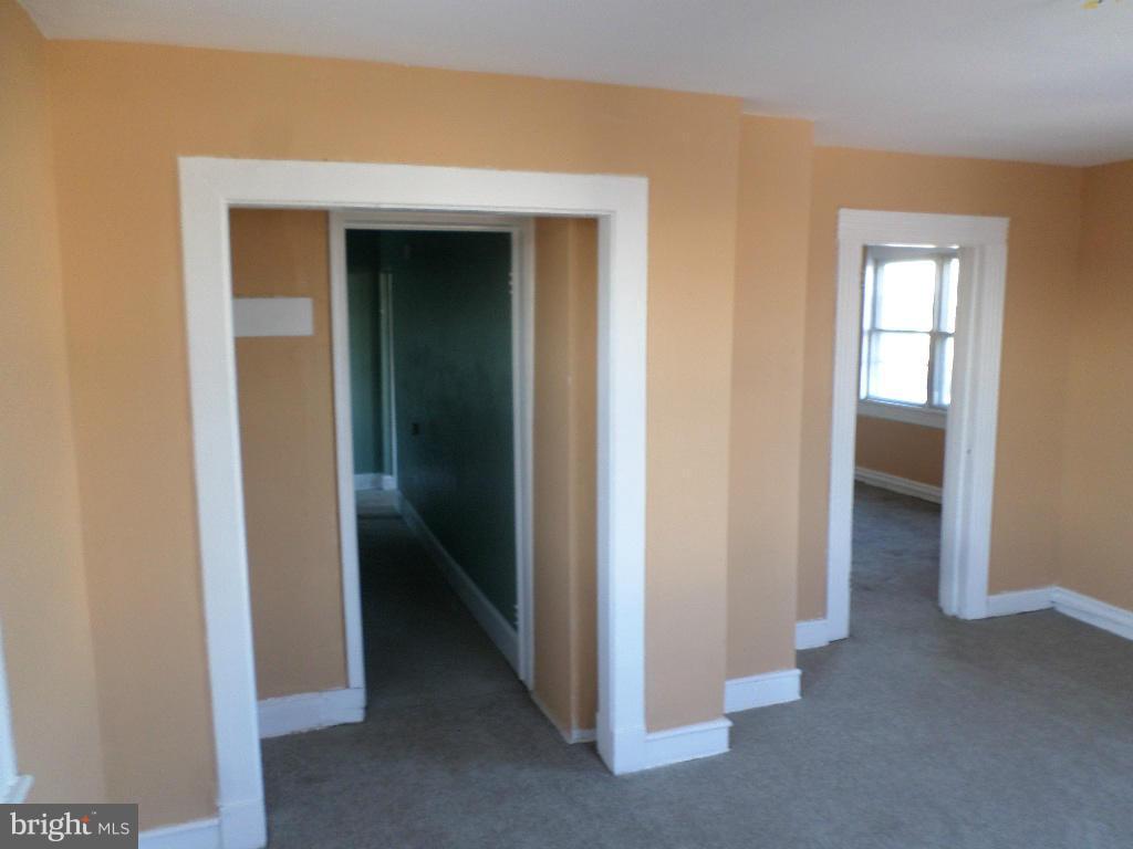 4534 Harford Road Baltimore, MD 21214 - Photo 15 of 18 a view of hallway with closet and wooden floor