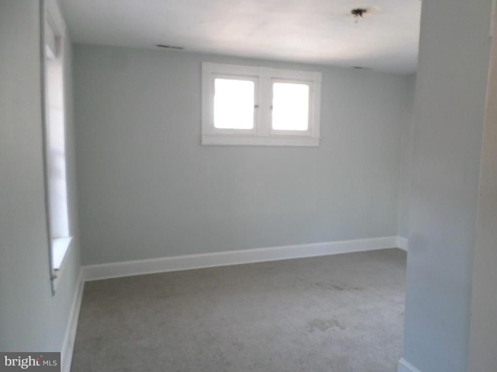 4534 Harford Road Baltimore, MD 21214 - Photo 18 of 18 an empty room with a window