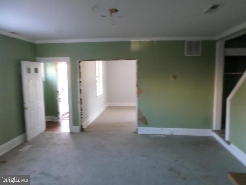 4534 Harford Road Baltimore, MD 21214 - Photo 10 of 18 an empty room with closet and windows