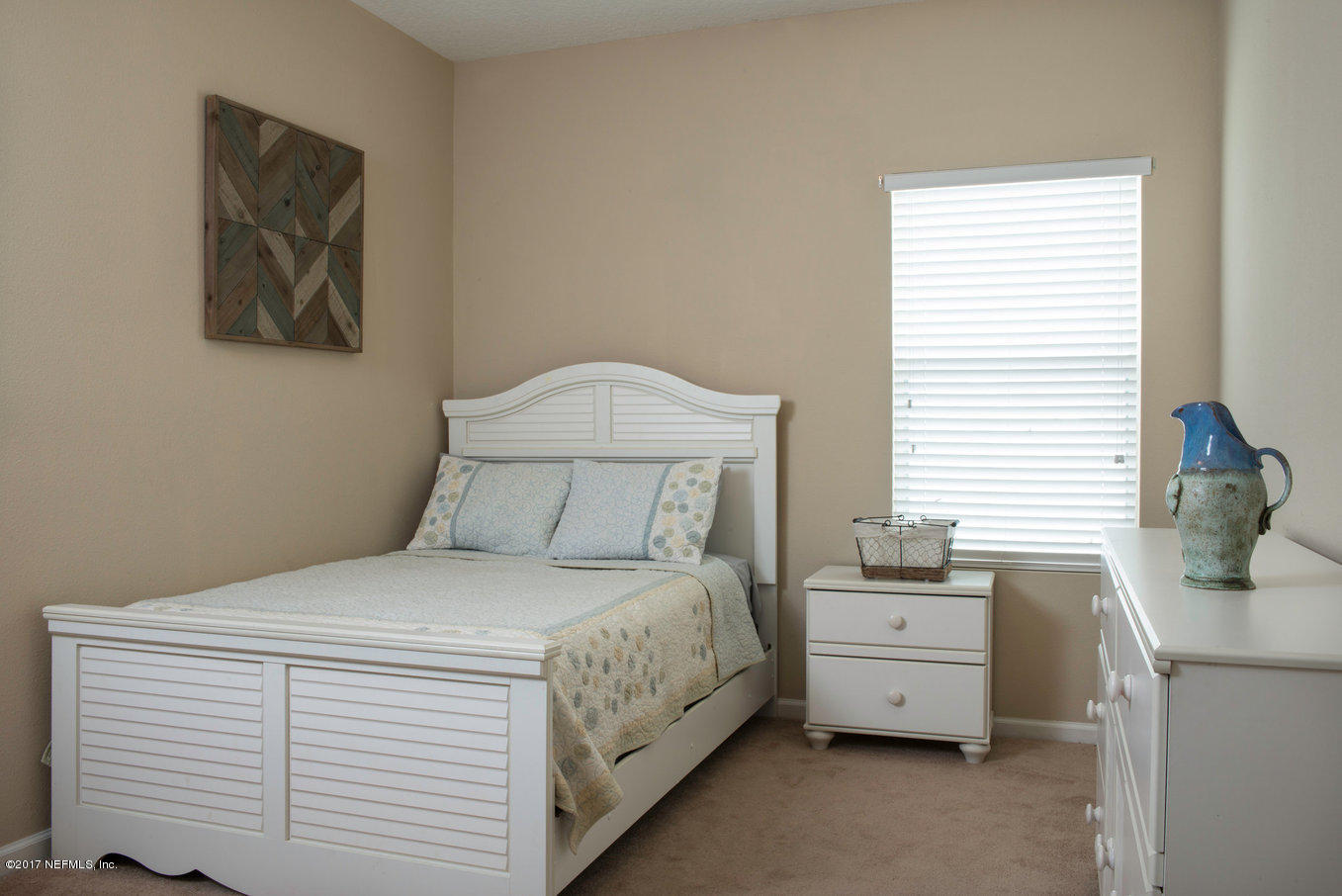 16365 Tisons Bluff Road Jacksonville, FL 32218 - Photo 11 of 25 a bedroom with a bed and a dresser