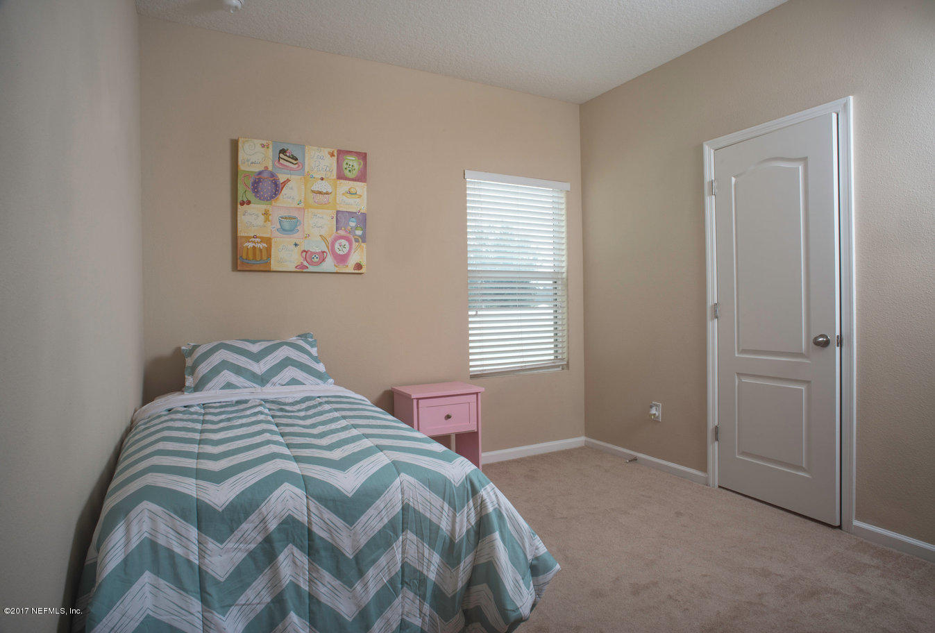 16365 Tisons Bluff Road Jacksonville, FL 32218 - Photo 12 of 25 a bedroom with a bed and a window