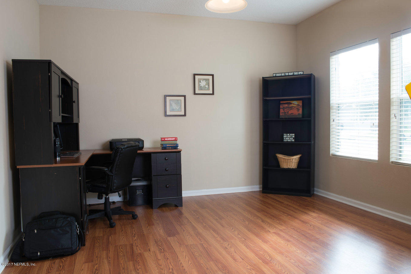 16365 Tisons Bluff Road Jacksonville, FL 32218 - Photo 13 of 25 a view of a workspace with furniture and a window