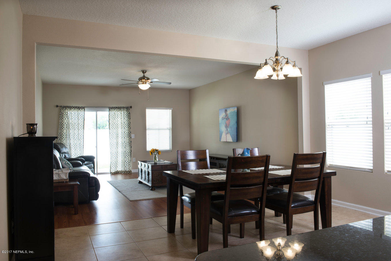 16365 Tisons Bluff Road Jacksonville, FL 32218 - Photo 4 of 25 a view of a dining room with furniture and window