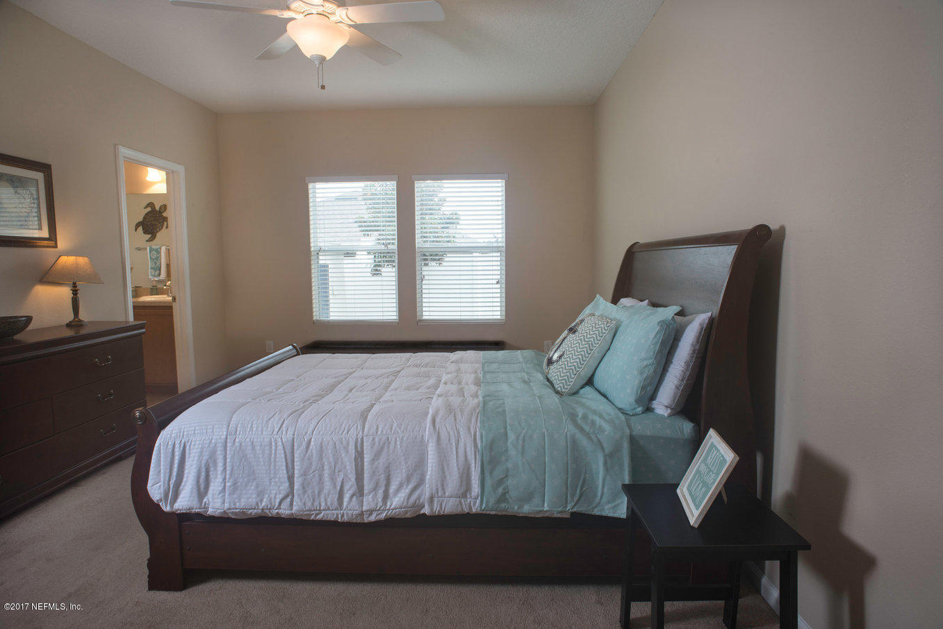 16365 Tisons Bluff Road Jacksonville, FL 32218 - Photo 8 of 25 a bedroom with a bed and window