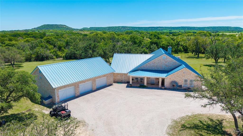 3612 Highway 1689 Comanche, TX 76442 - Photo 3 of 30 View of subject property featuring a heavily wooded area and mountains