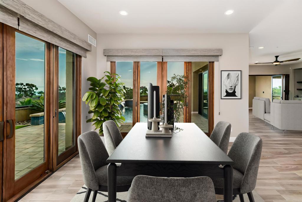6768 Strawberry Place Carlsbad, CA 92011 - Photo 13 of 53 a view of a dining room with furniture window and wooden floor