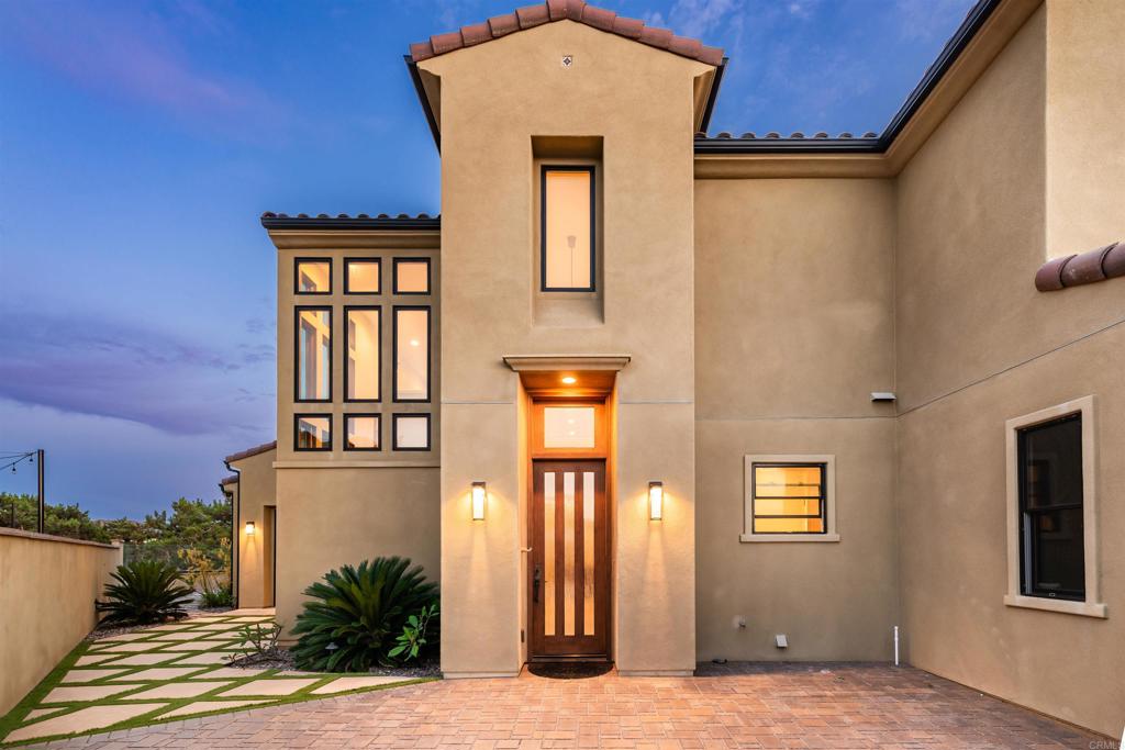 6768 Strawberry Place Carlsbad, CA 92011 - Photo 4 of 53 a view of front door of house and yard