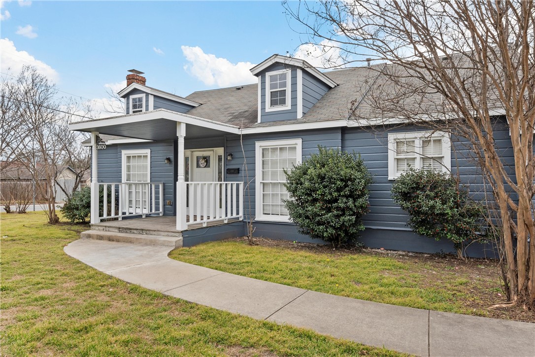 3600 Sanger Avenue Waco, TX 76710 - Photo 2 of 24 a view of a house with a small yard plants and large tree