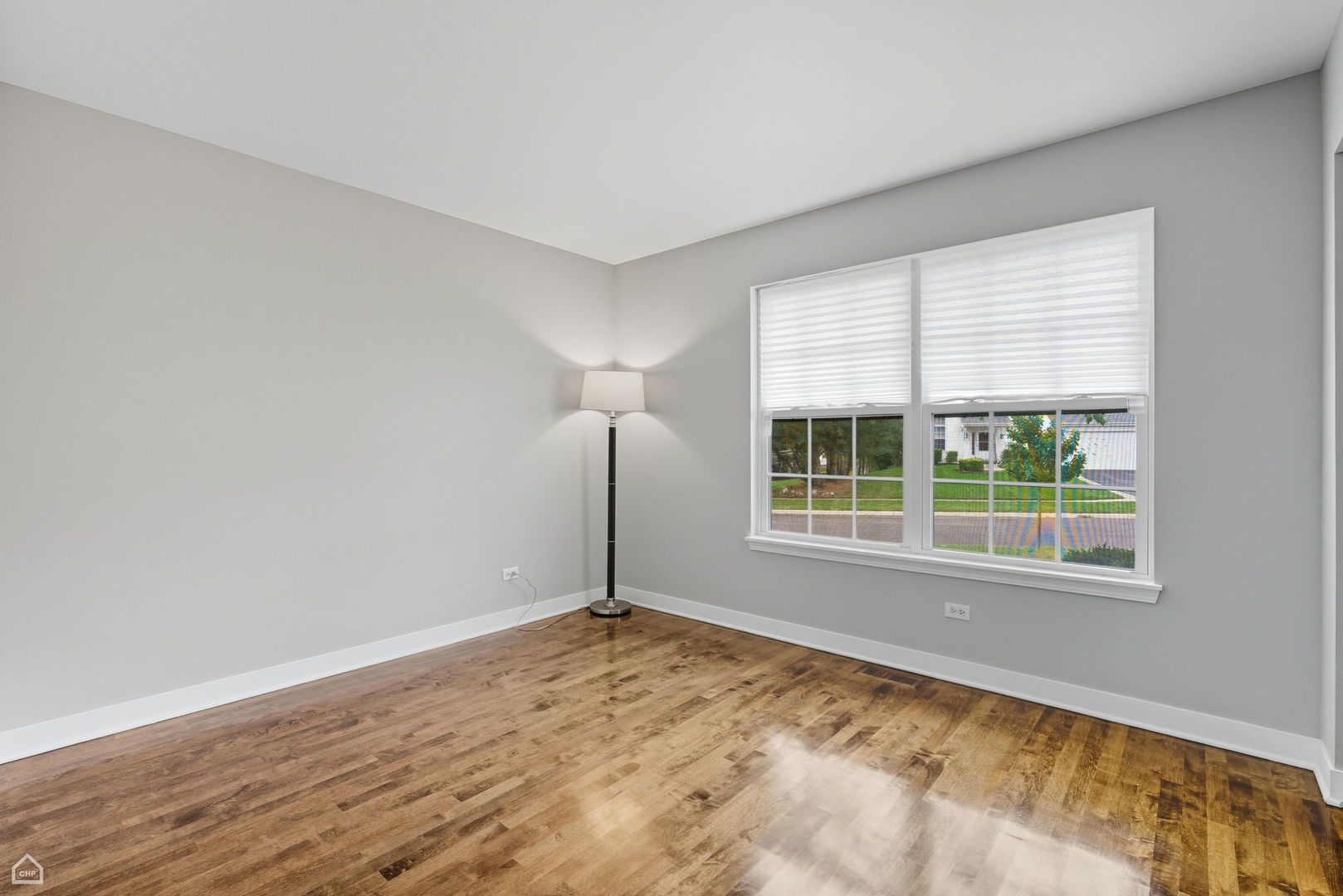 2008 Crooked Tree Court McHenry, IL 60050 - Photo 14 of 22 an empty room with wooden floor and windows