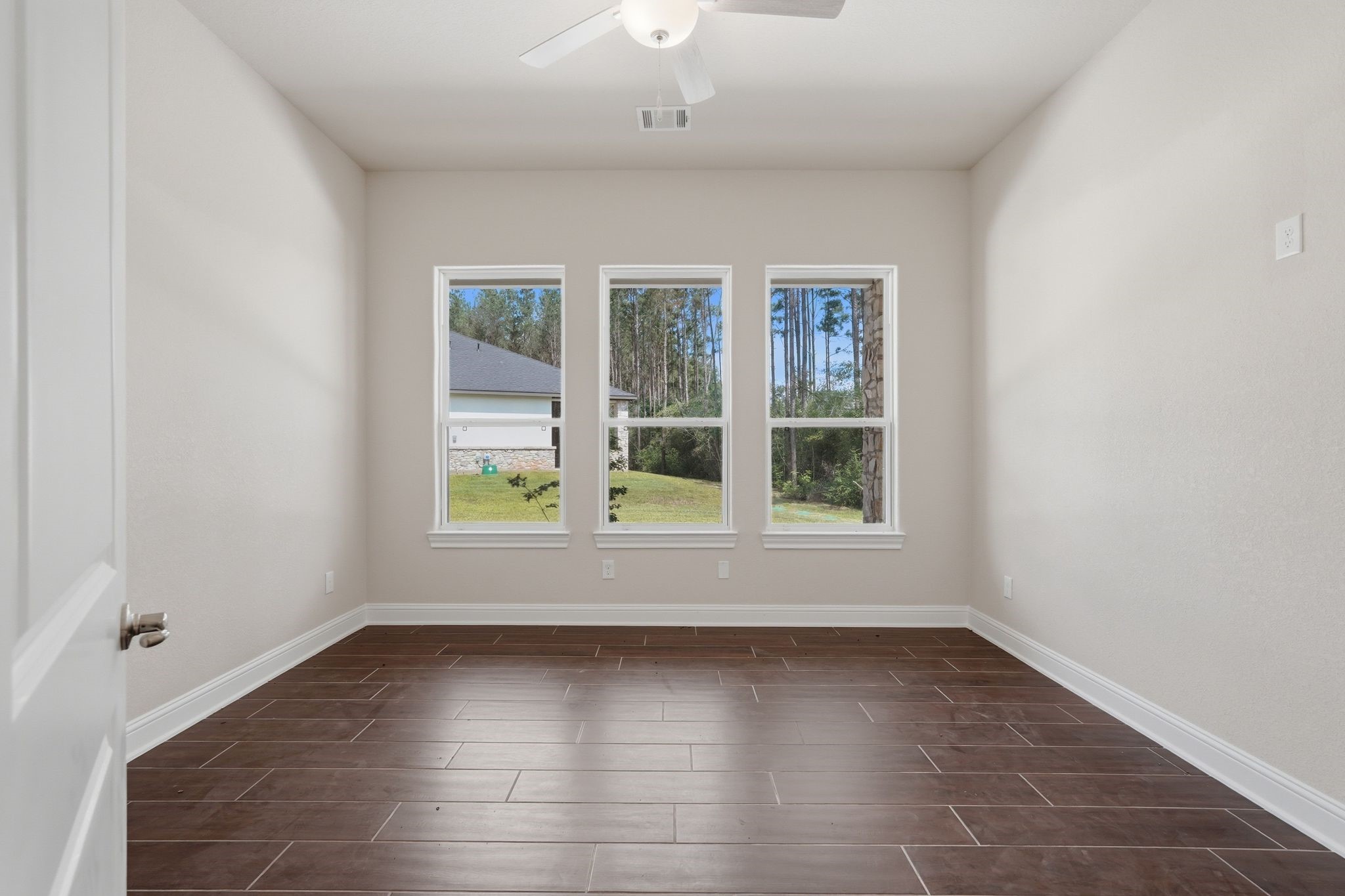16081 Forest Mill Road Willis, TX 77378 - Photo 35 of 37 Bright and inviting secondary bedroom featuring beautiful natural light, peaceful views, and comfortable accommodations for family or guests.