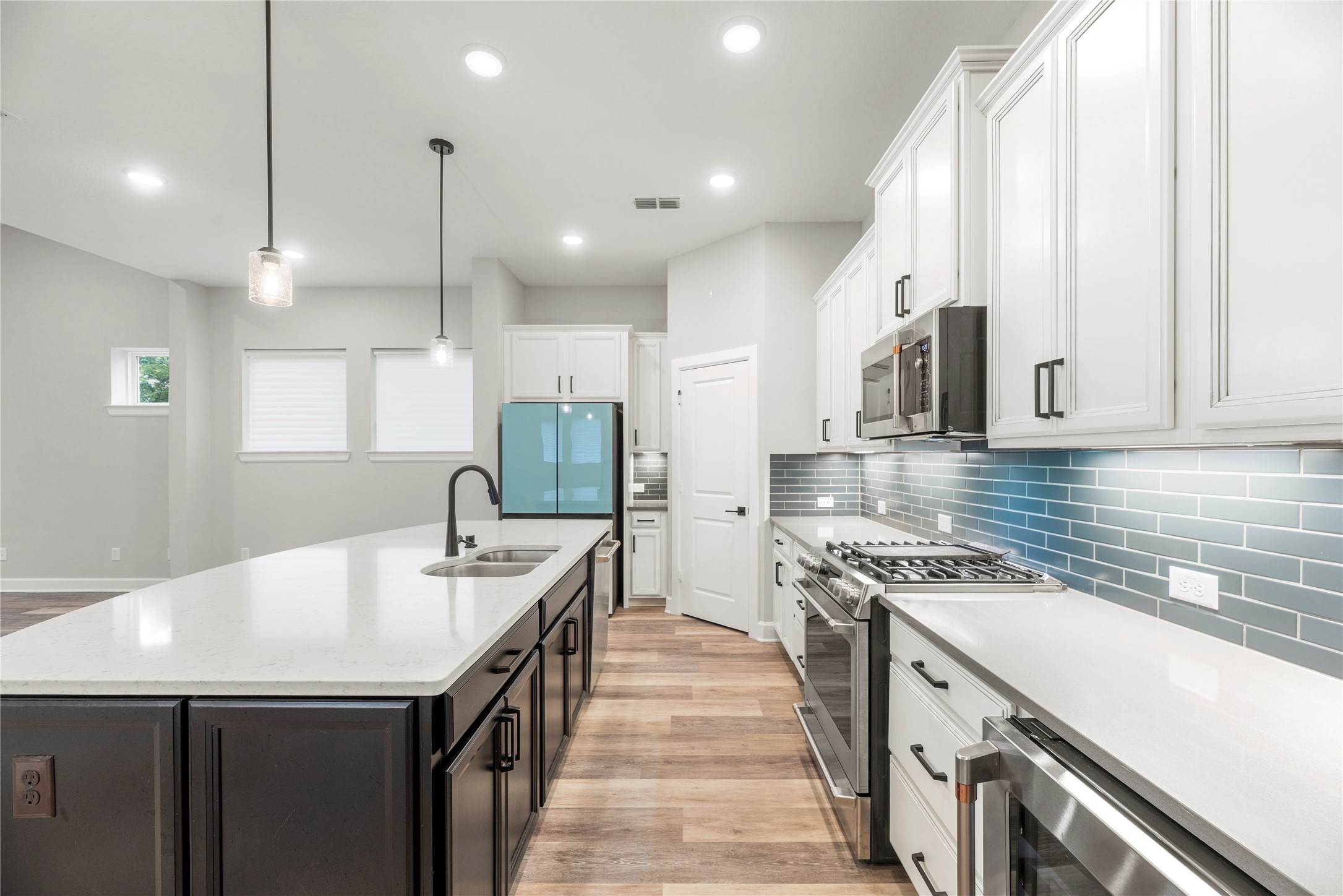 3438 Rich Radish Road Richmond, TX 77406 - Photo 6 of 25 This premium workspace comes fully equipped with a top-of-the-line, matching GE Café appliance package, which includes a professional gas cooktop, a single convection oven, an integrated microwave, and an undermount.