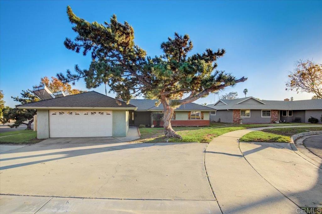 9683 Balsa Street Rancho Cucamonga, CA 91730 - Photo 1 of 1 a front view of a house with a yard and garage