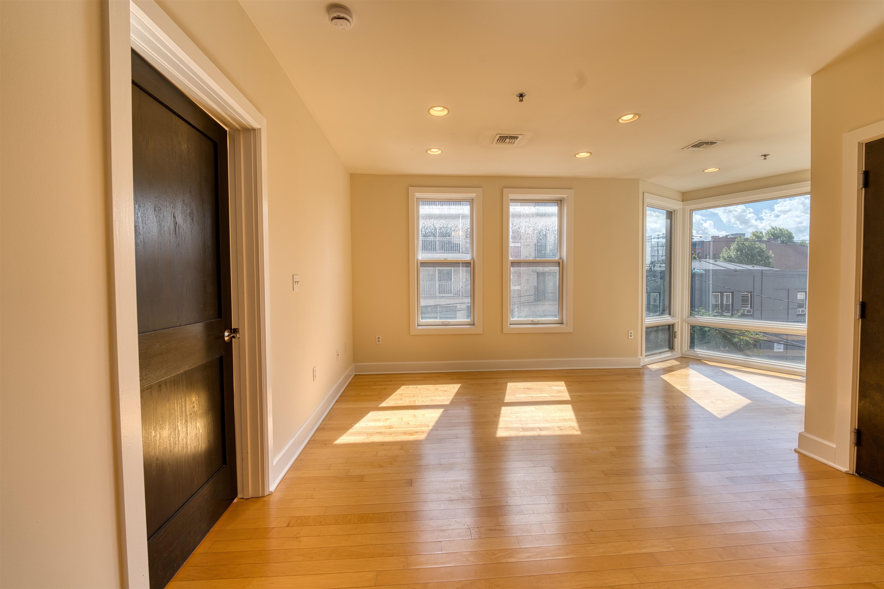 108 Jackson Street, Unit 3A Hoboken, NJ 07030 - Photo 14 of 30 a view of an entryway with wooden floor and windows