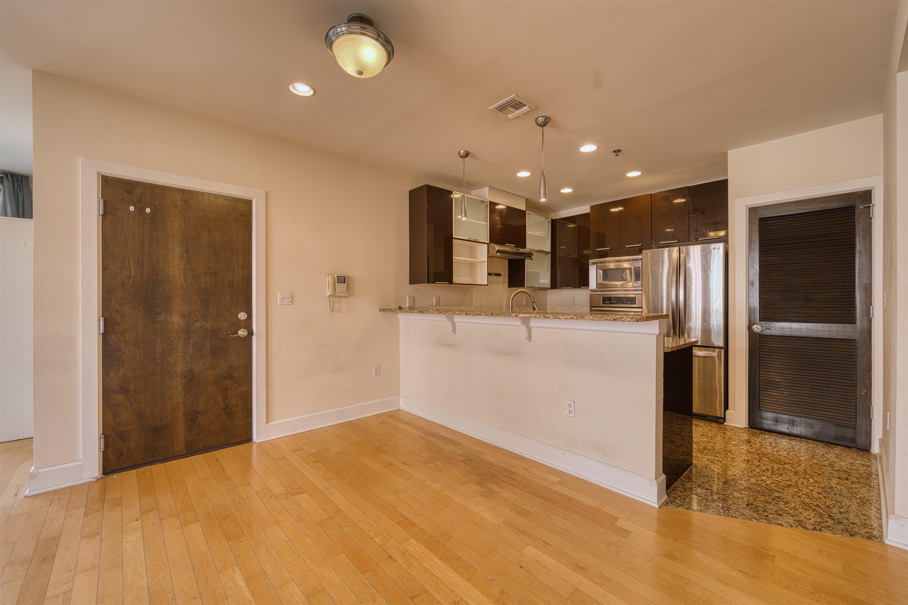 108 Jackson Street, Unit 3A Hoboken, NJ 07030 - Photo 16 of 30 a view of a kitchen with refrigerator and wooden floor