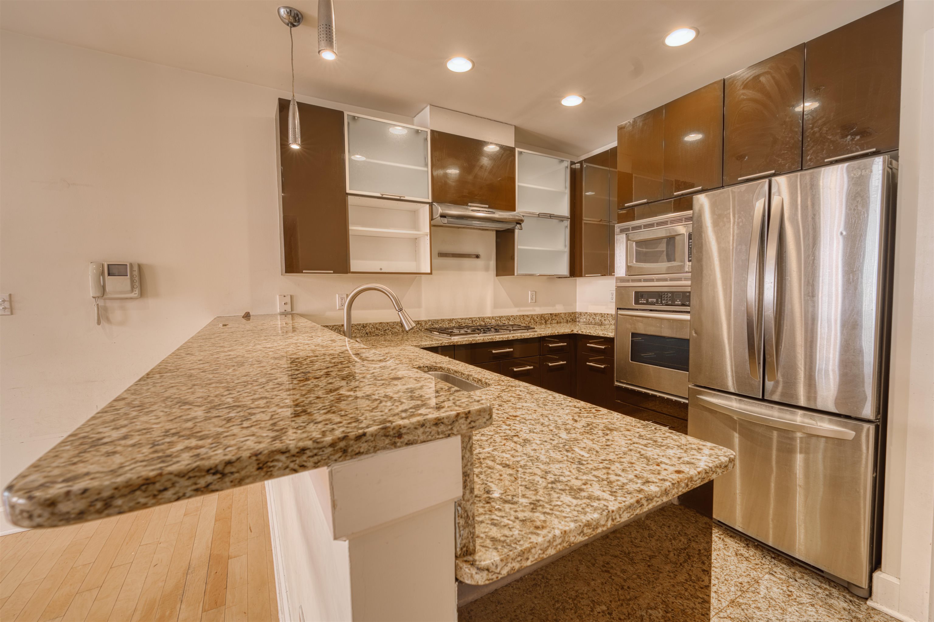 108 Jackson Street, Unit 3A Hoboken, NJ 07030 - Photo 17 of 30 a kitchen with stainless steel appliances granite countertop a sink and a refrigerator