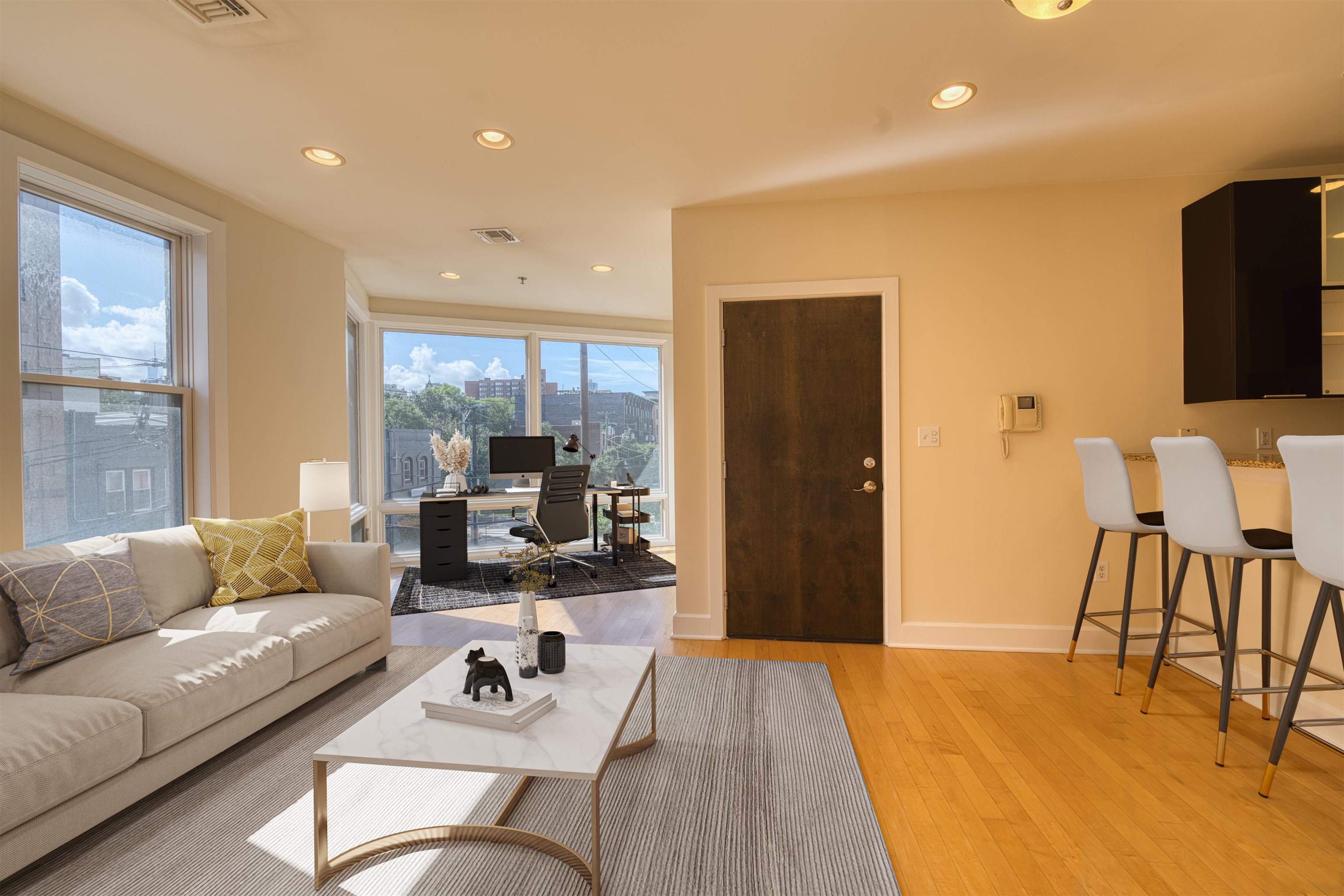 108 Jackson Street, Unit 3A Hoboken, NJ 07030 - Photo 2 of 30 a living room with furniture and a flat screen tv