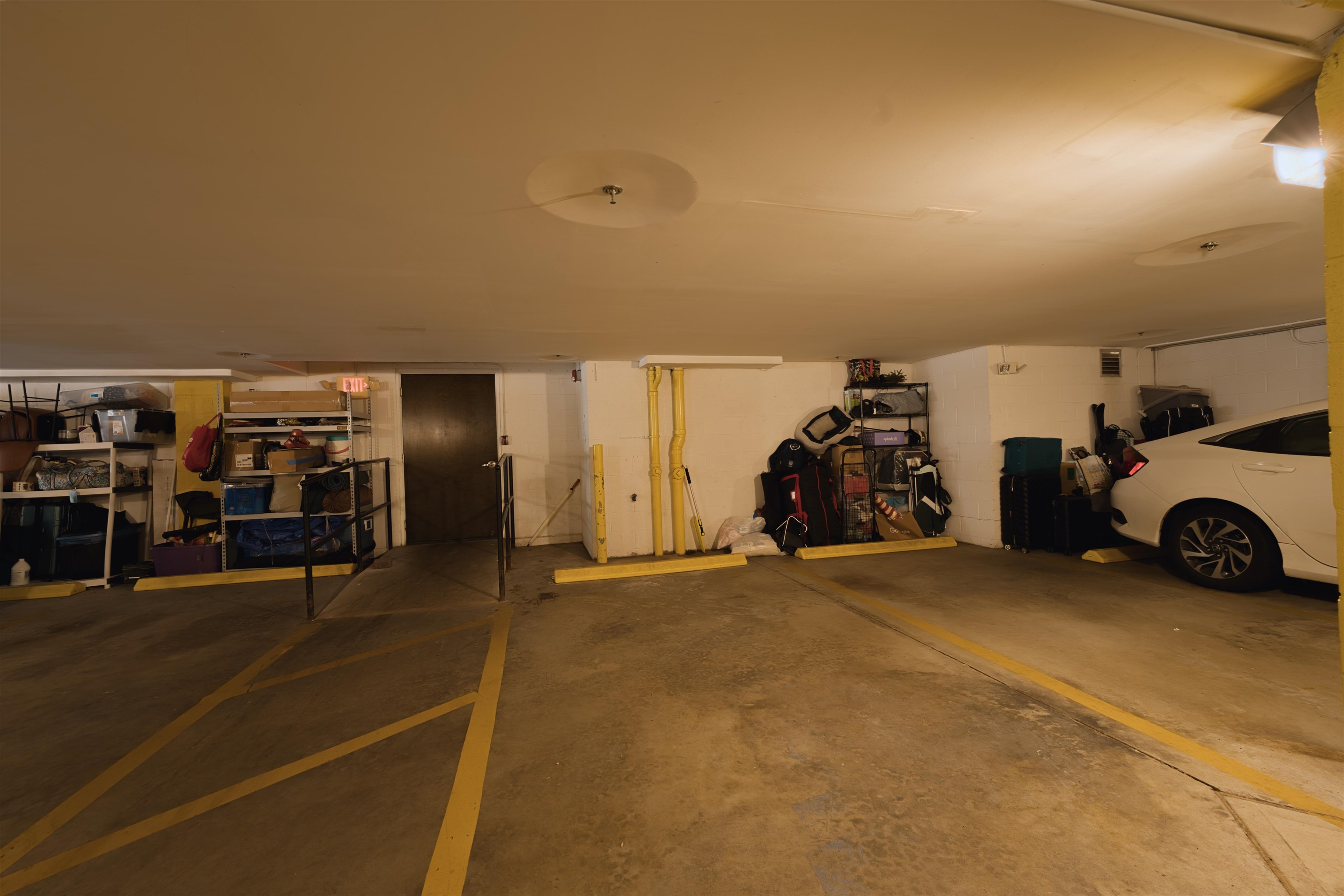 108 Jackson Street, Unit 3A Hoboken, NJ 07030 - Photo 27 of 30 a view of a garage with cars