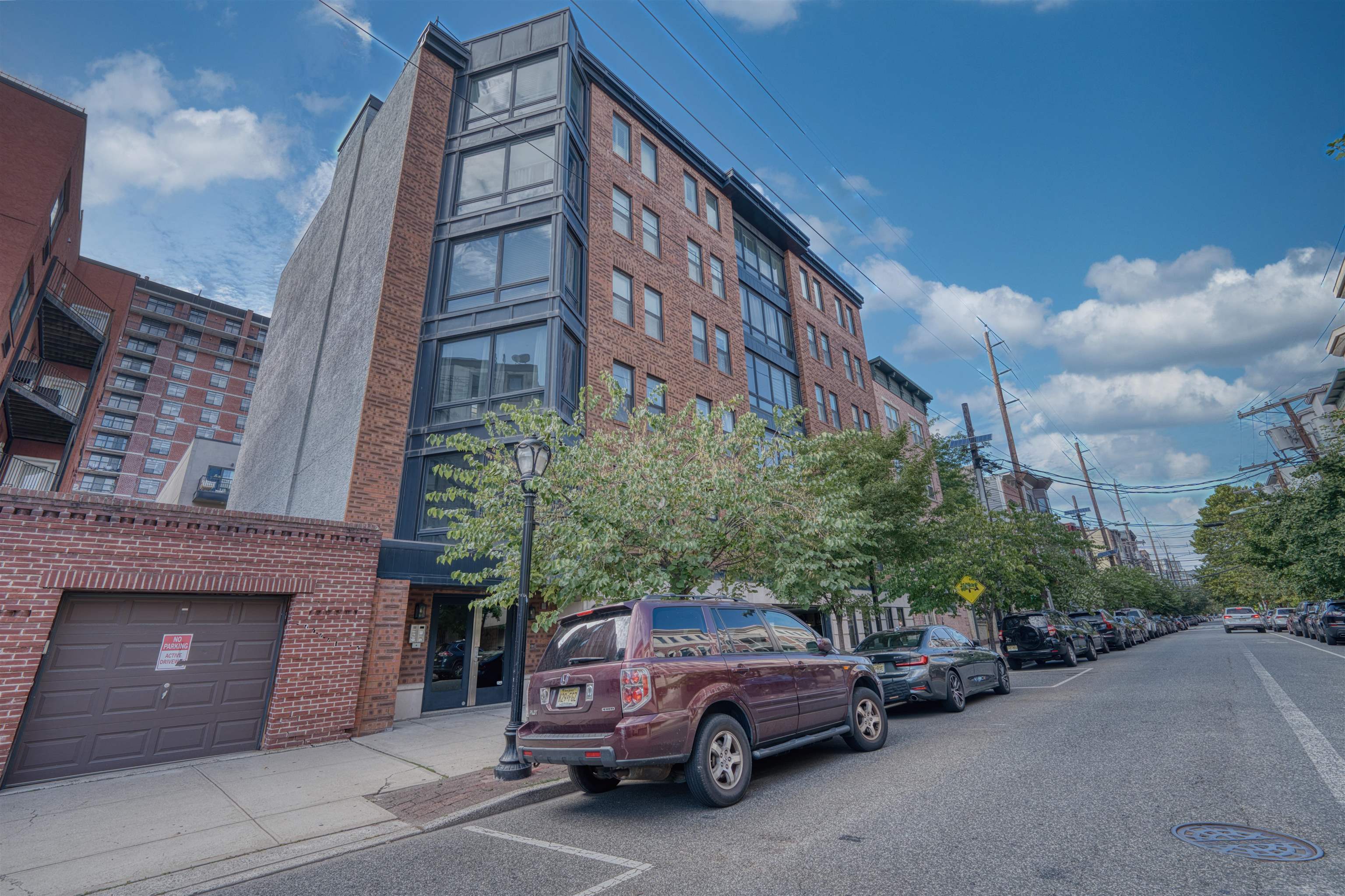 108 Jackson Street, Unit 3A Hoboken, NJ 07030 - Photo 5 of 30 a view of a car parked in front of a building