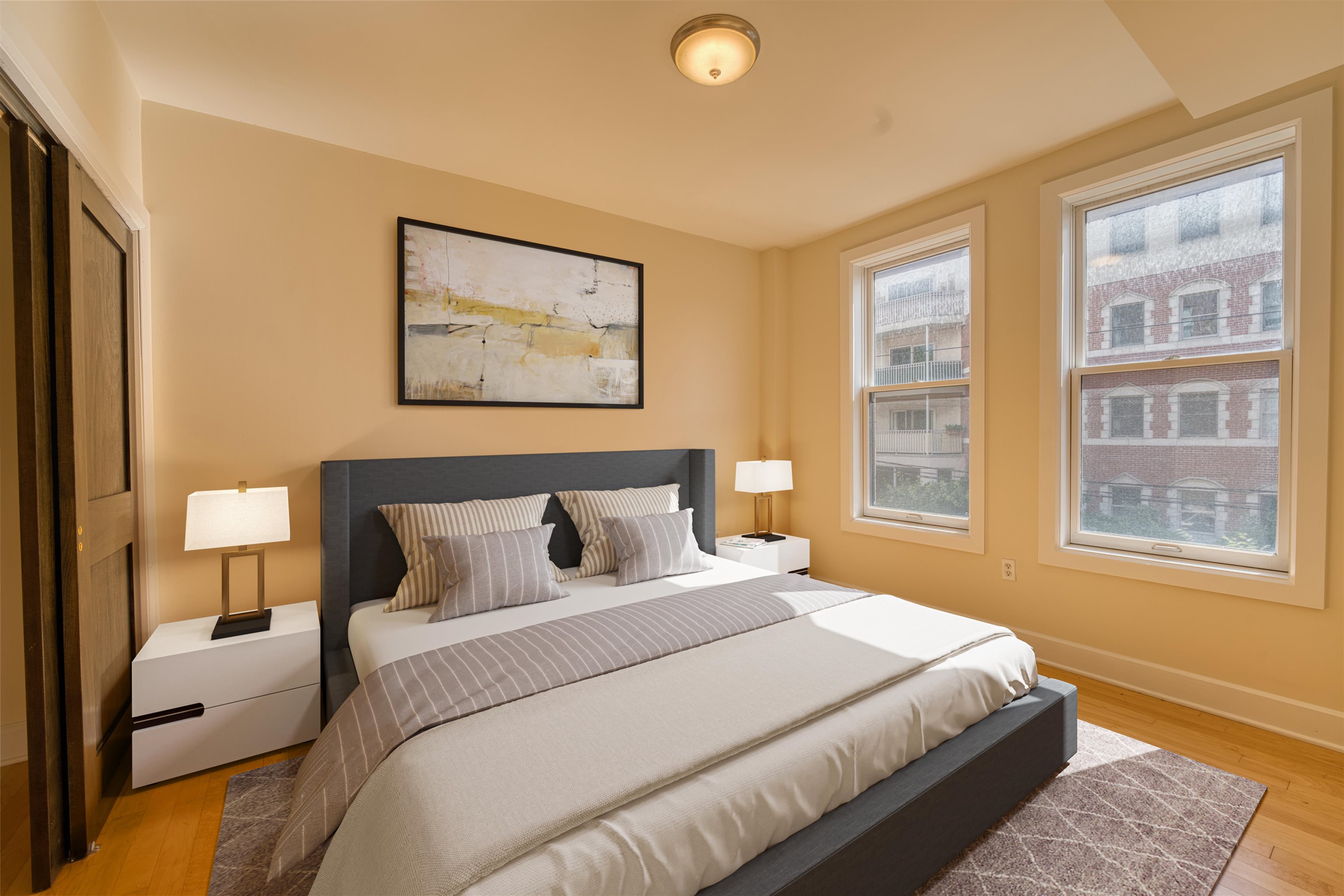 108 Jackson Street, Unit 3A Hoboken, NJ 07030 - Photo 6 of 30 a bedroom with a bed and a window
