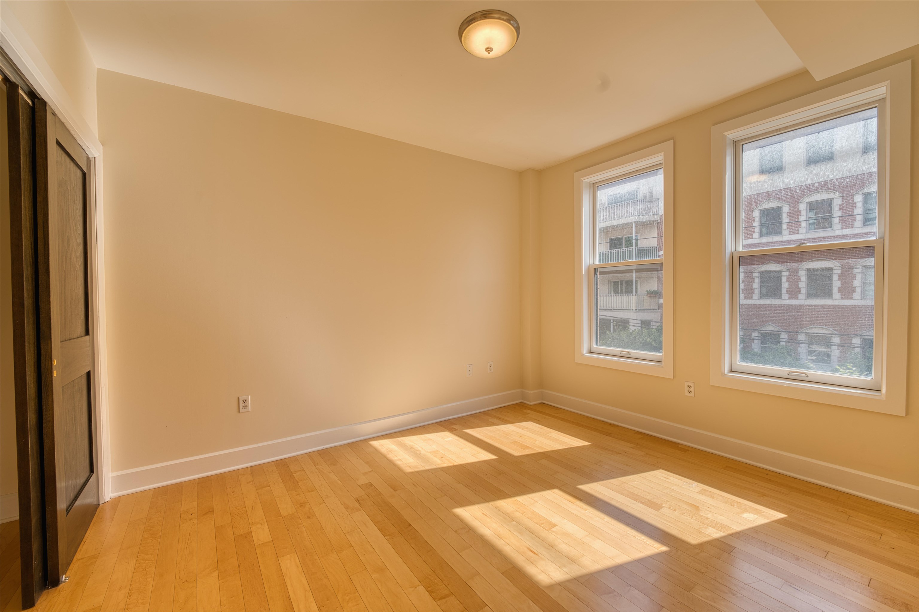 108 Jackson Street, Unit 3A Hoboken, NJ 07030 - Photo 7 of 30 a view of an empty room with a window