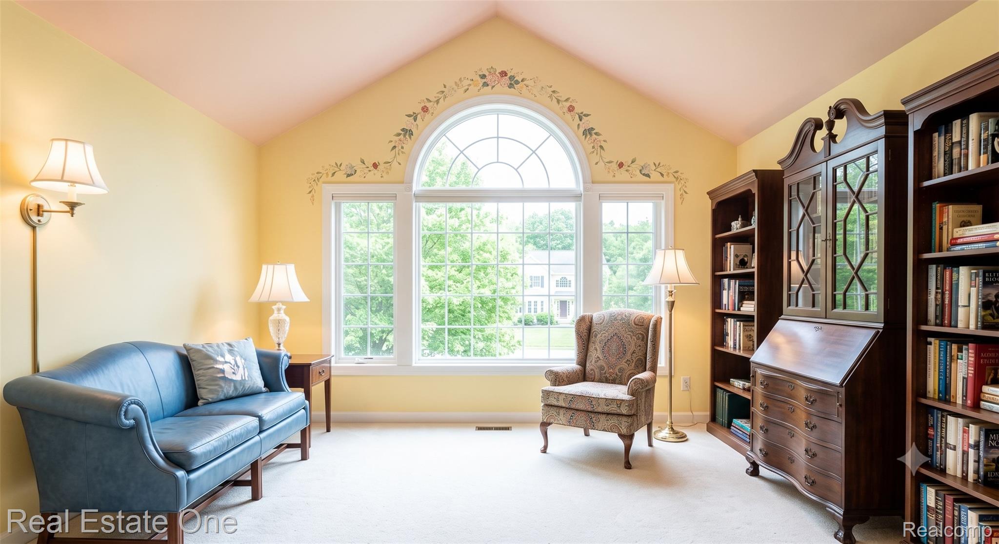1793 Skyline Drive Rochester, MI 48306 - Photo 24 of 38 Vaulted ceiling room featuring a large arched window, wall sconces, and built-in wood cabinetry
