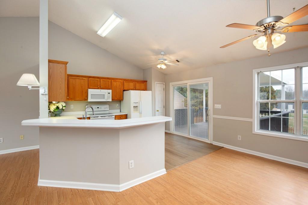 8440 River Bluff Place Ball Ground, GA 30107 - Photo 20 of 73 a kitchen with stainless steel appliances a sink stove and cabinets