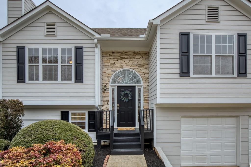 8440 River Bluff Place Ball Ground, GA 30107 - Photo 2 of 73 a front view of a house with a window