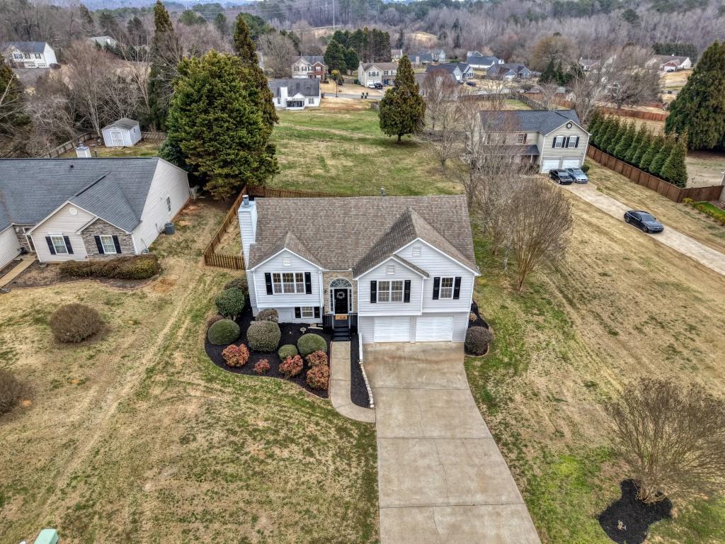 8440 River Bluff Place Ball Ground, GA 30107 - Photo 3 of 73 an aerial view of a house with a yard