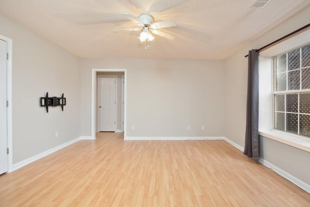 8440 River Bluff Place Ball Ground, GA 30107 - Photo 43 of 73 wooden floor in an empty room with a window