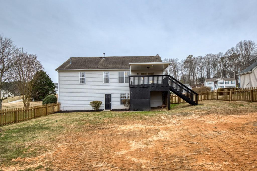 8440 River Bluff Place Ball Ground, GA 30107 - Photo 55 of 73 a view of a house with a snow in the background