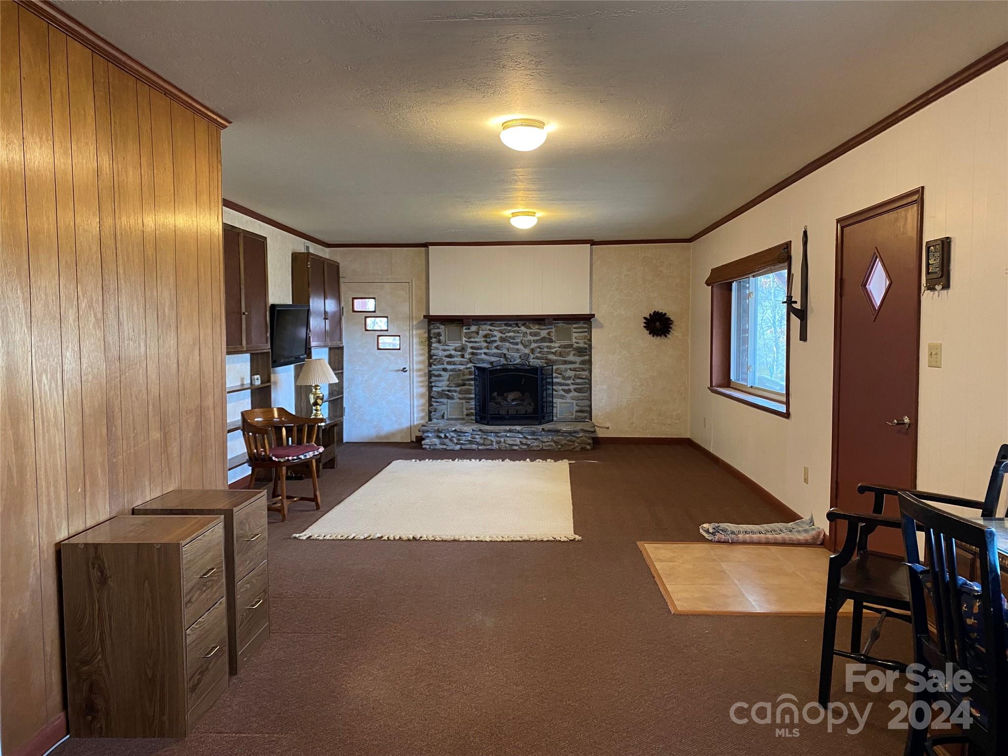 344 Pine Ridge Trail Almond, NC 28702 - Photo 16 of 34 a living room with furniture and a fireplace