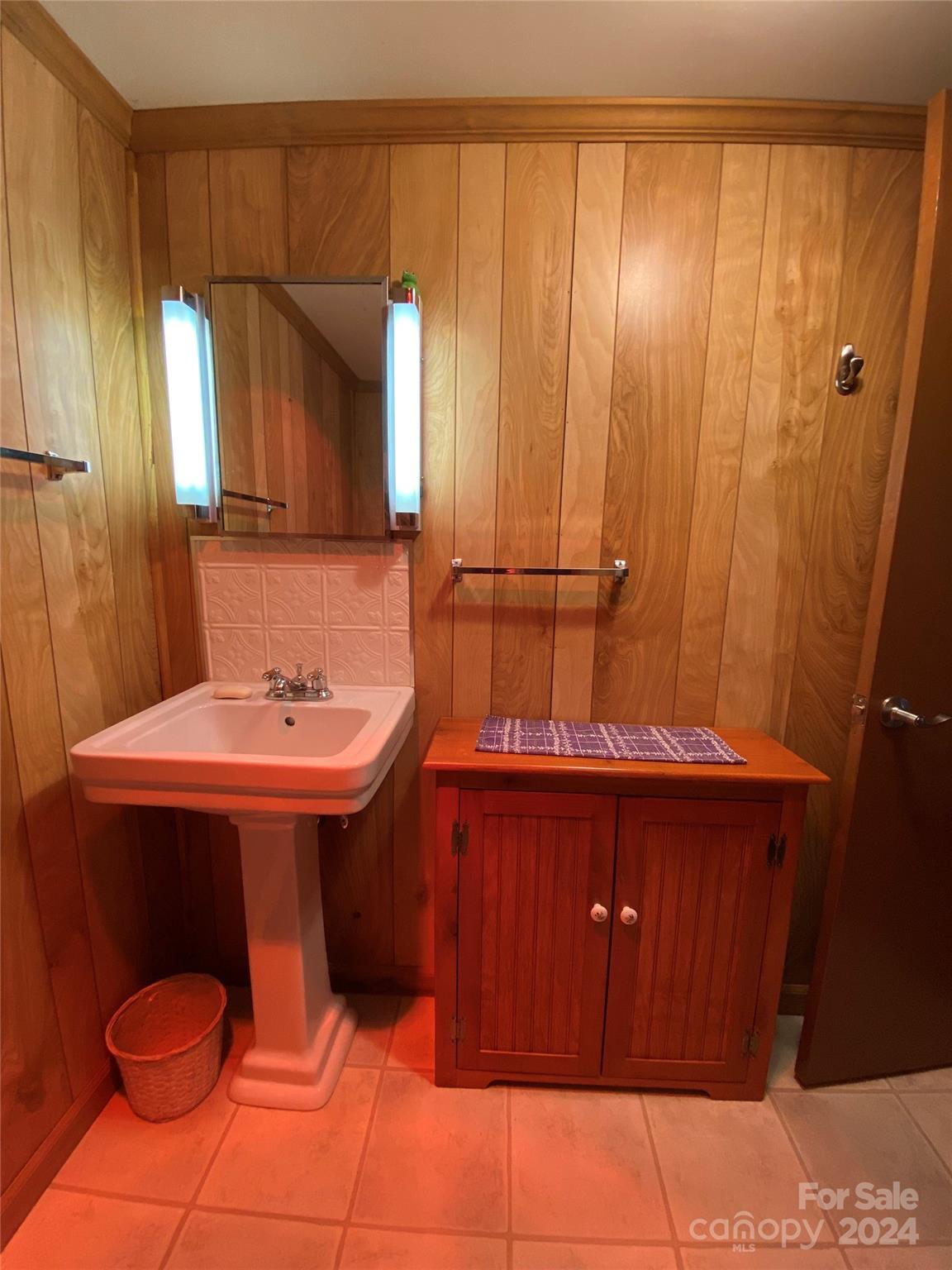 344 Pine Ridge Trail Almond, NC 28702 - Photo 19 of 34 a bathroom with a sink and a mirror