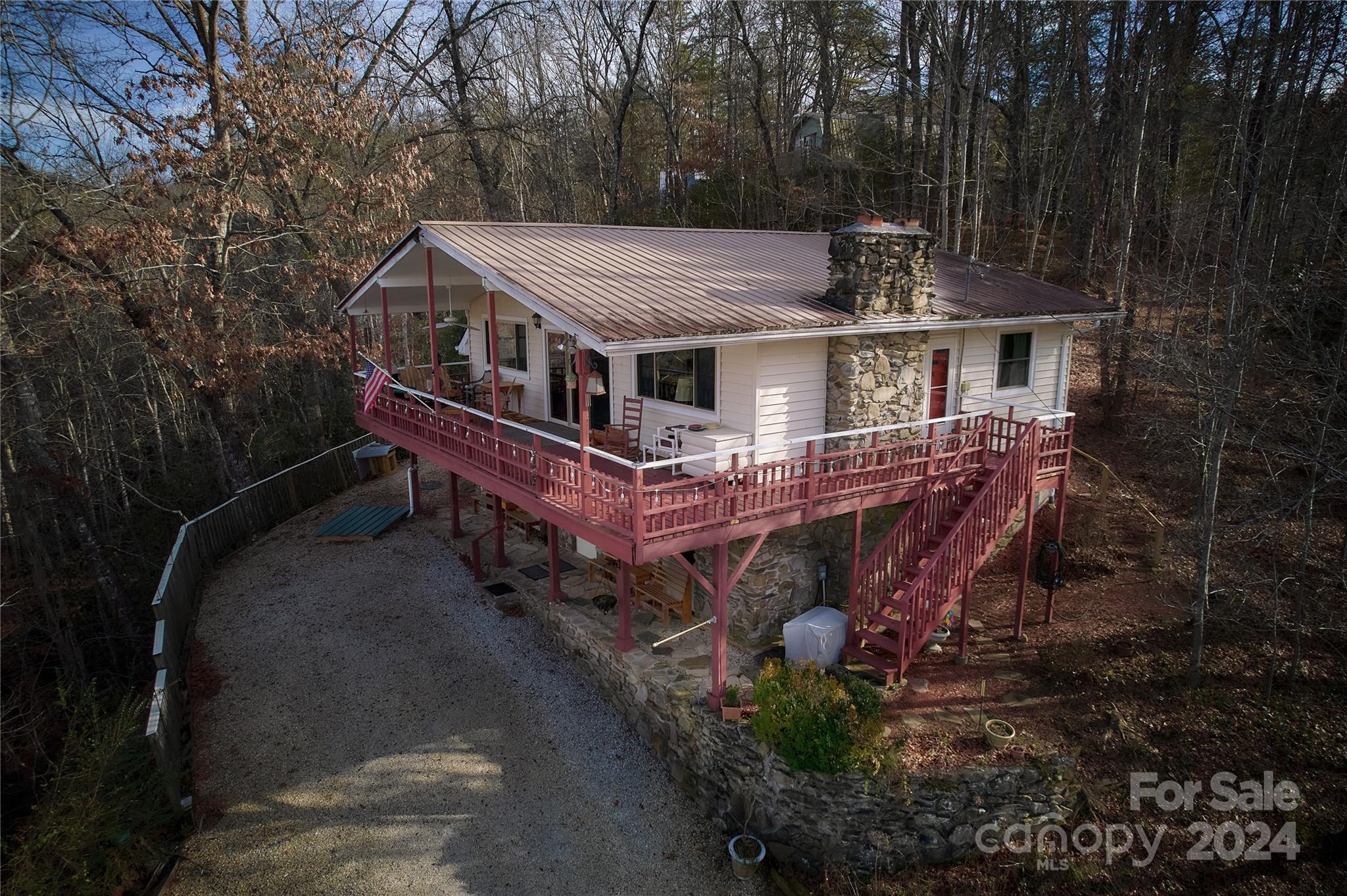 344 Pine Ridge Trail Almond, NC 28702 - Photo 2 of 34 a view of a house with a small yard and large trees