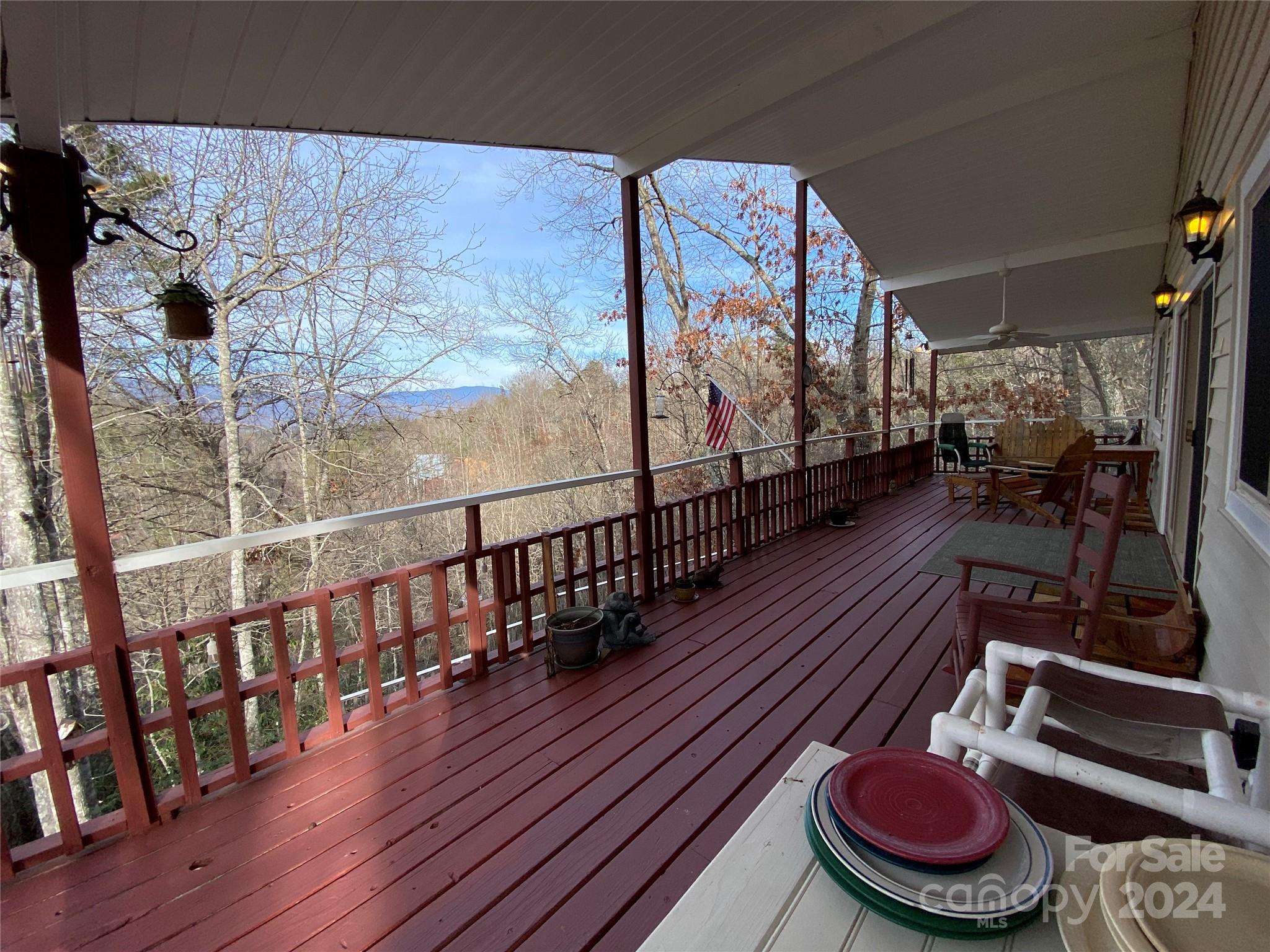344 Pine Ridge Trail Almond, NC 28702 - Photo 22 of 34 a room with wooden floor and furniture