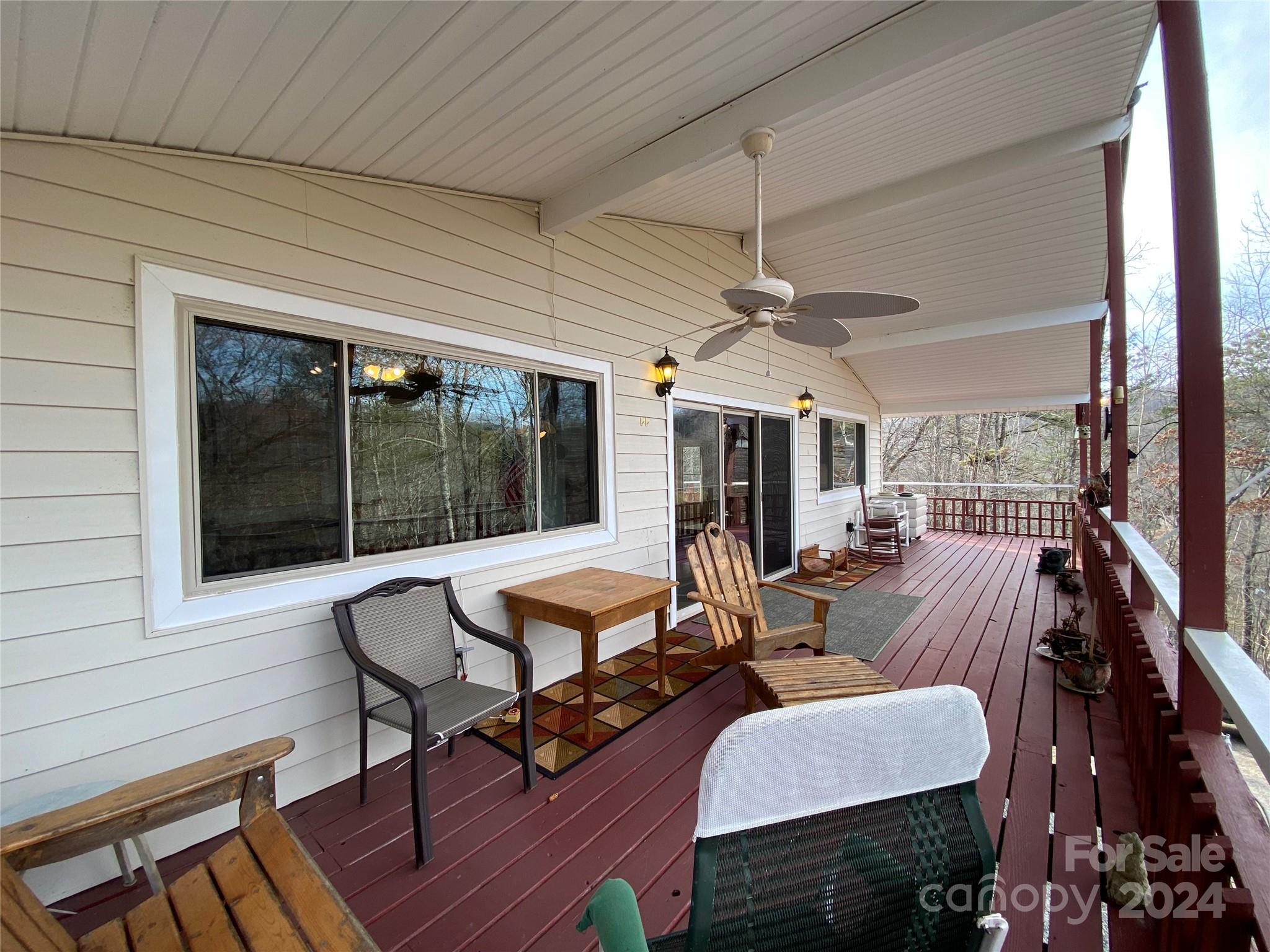 344 Pine Ridge Trail Almond, NC 28702 - Photo 24 of 34 a view of a patio with dining table and chairs