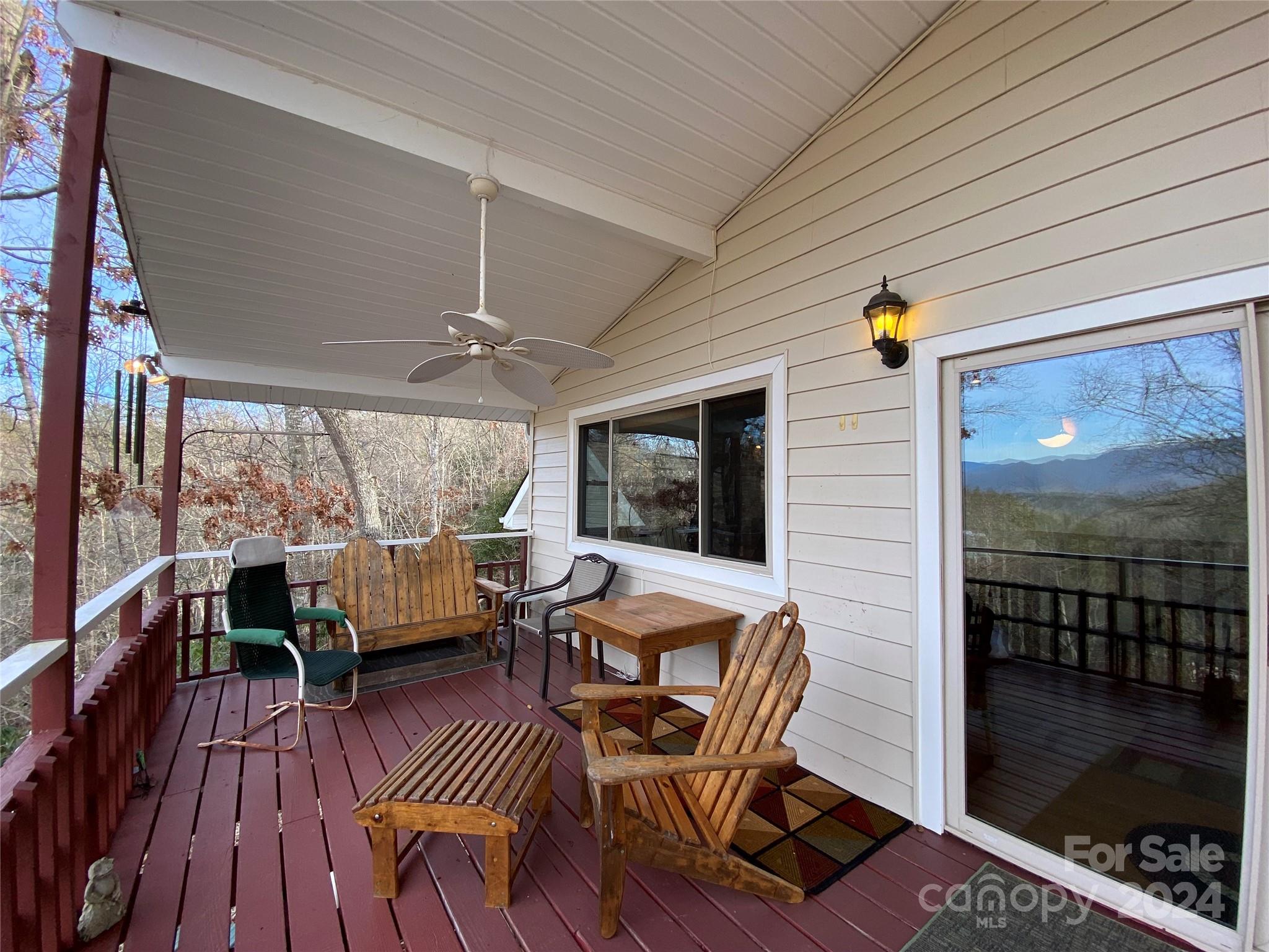 344 Pine Ridge Trail Almond, NC 28702 - Photo 25 of 34 a outdoor space with patio the couches and a dining table with garden view