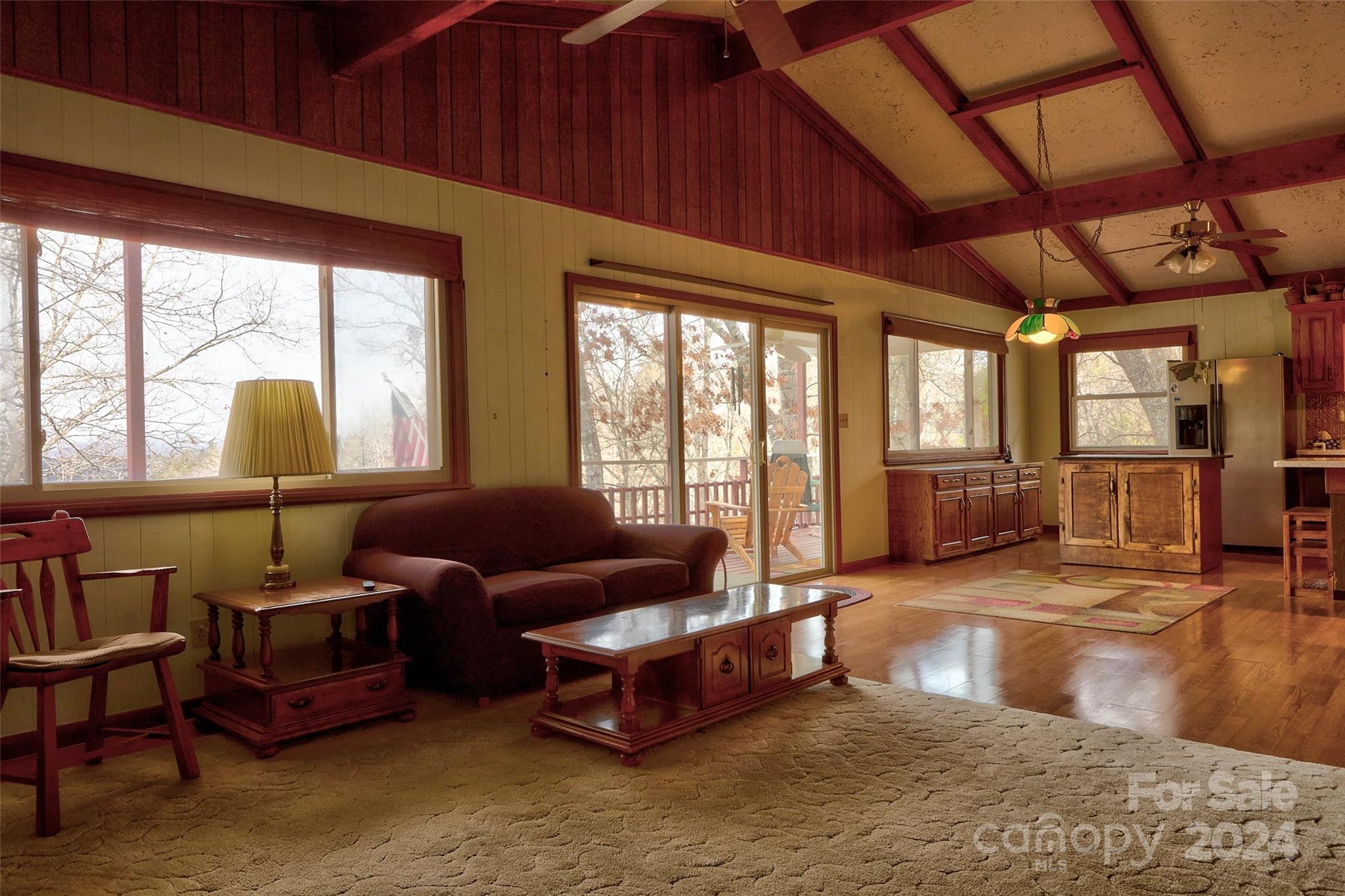 344 Pine Ridge Trail Almond, NC 28702 - Photo 9 of 34 a living room with furniture and large windows