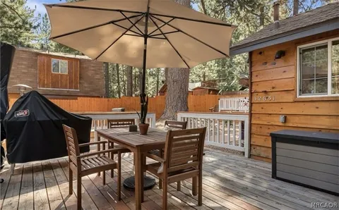 an outdoor space with furniture and umbrella