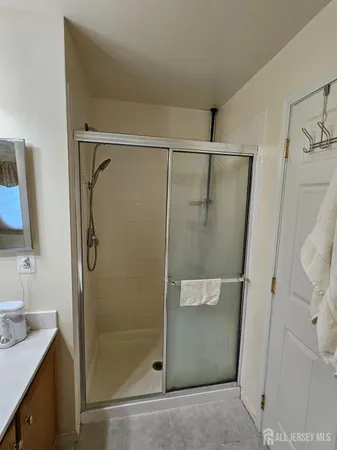 a bedroom with bed and window