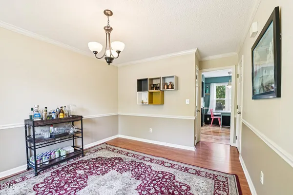 a bedroom with furniture and a rug