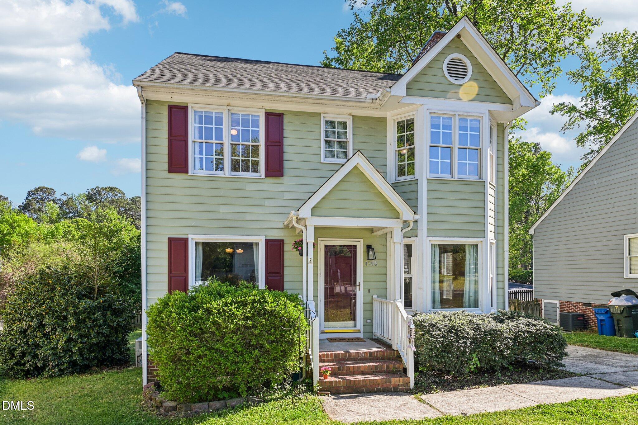 4508 Emmit Drive Raleigh, NC 27604 - Photo 2 of 42 a front view of a house with garden